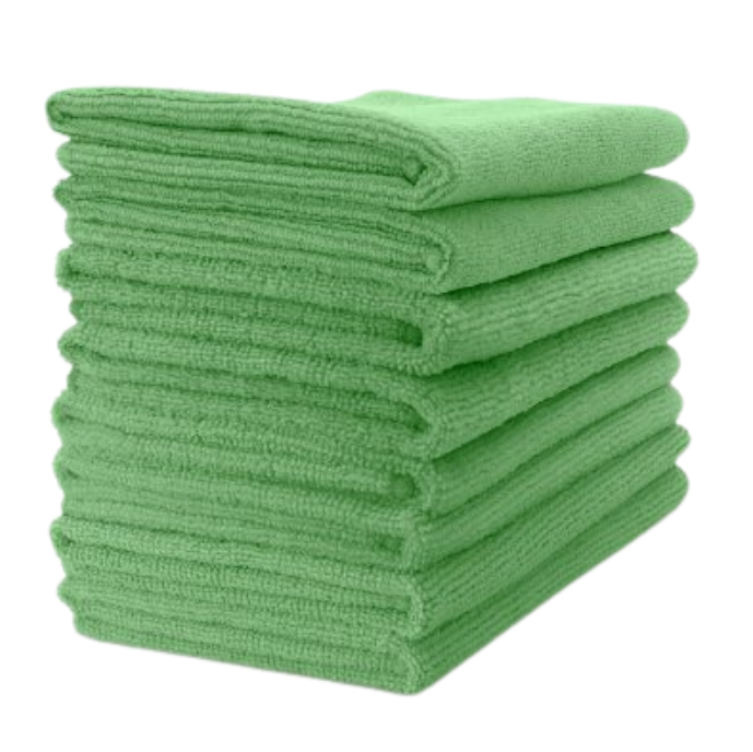 Stack of green folded towels on a white background